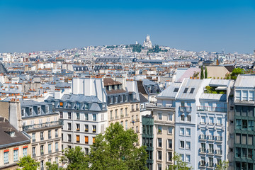Paris, panorama of the city, typical roofs and buildings, with Montmartre and the Sacre-Choeur...