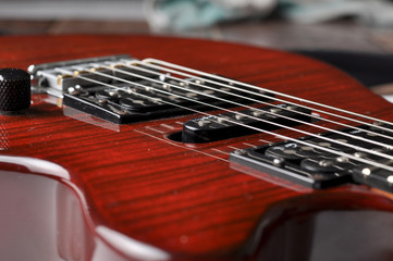 Fototapeta na wymiar Red guitar isolated on white background.