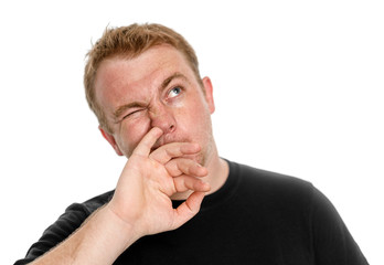 Guy picks his nose isolated on white background