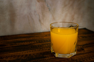 Fresh orange juice glass on the table.