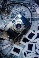 OLD PHOTO CAMERA ON PHOTOGRAPHS AND SLIDES
