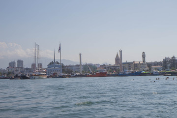 Fototapeta premium View Of Embankment Of Georgian Resort Town Of Batumi. Sea And Modern Urban Architecture Skyscrapers. View From Sea