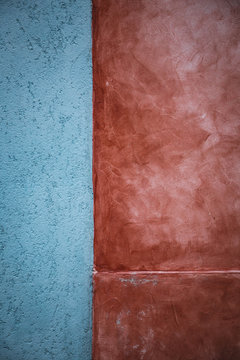 Abstract background - part of a wall: blue and terracotta colored