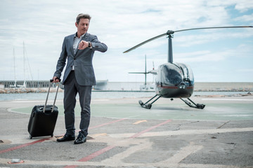 Businessman standing near private helicopter © Nejron Photo