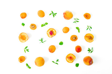 Fruit pattern of ripe peaches with leaves isolated on white background. Top view. Flat lay