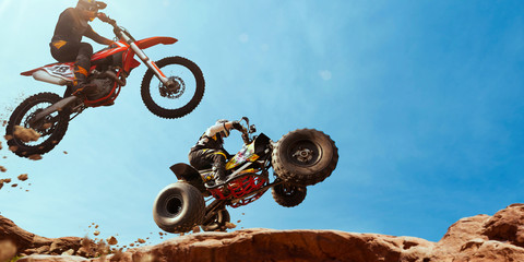 ATV Rider in the action with motocross  rider.