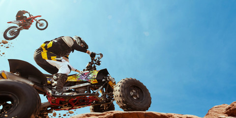 ATV Rider in the action with motocross  rider. © Artur Didyk