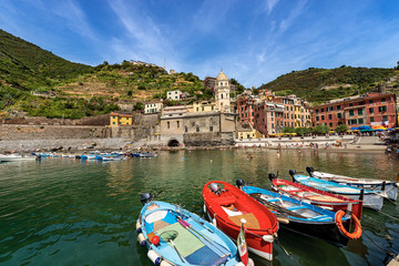 Ancient village of Vernazza with the boats in the harbor. Cinque Terre, National park in Liguria, La Spezia province, Italy, Europe. UNESCO world heritage site © Alberto Masnovo