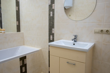 Interior of bathroom with sink basin faucet and mirror. Modern design of bathroom