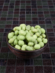 Crunchy whole peanuts with a wasabi-flavored coating