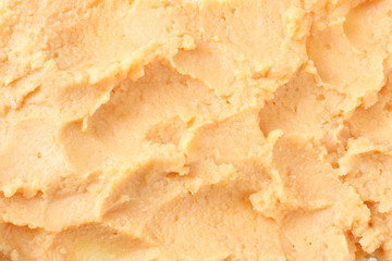 chickpea hummus background. mashed chickpea texture. top view