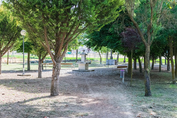 park with trees and stone fountain