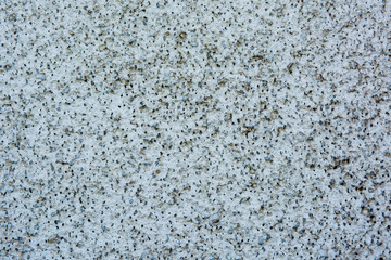 Background of small white and black rocks. Background and texture of small white and black rocks