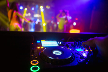 Obraz na płótnie Canvas DJ playing music on light background