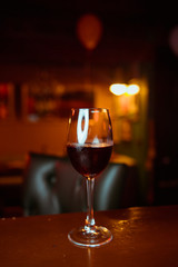 Empty wine glasses on the table at a party at night club.