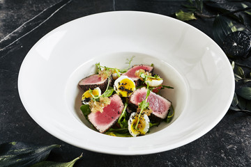 Exquisite Serving White Restaurant Plate of Tuna Fillet Salad with Quail Eggs and Salsa from Sweet...