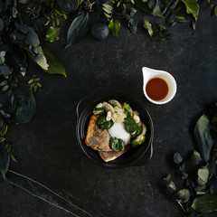 Beautiful Serving Branzino or Seabass Fillet with Bisque Sauce and Spinach Top View