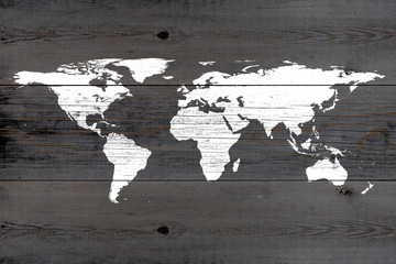 white world map painted on weathered wooden planks