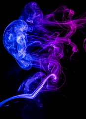 Colored smoke on black background