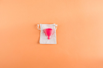 Pink menstrual cup for zero waste concept