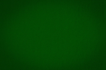 Texture of real dark green knitwear, textile background. Abstract background