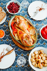 Festive dish for Thanksgiving, roasted turkey legs with vegetables on a table with snacks. Top view, flat lay.