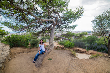 Summer holiday in Spain. Young woman on Barcelona sea coast.
