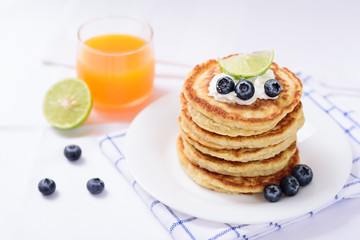 Oatmeal pancake with blueberry and orange juice