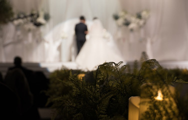 the appearance of a modern wedding in which the bride and groom officiate.