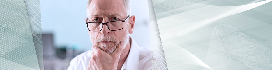 Thoughtful senior businessman; panoramic banner