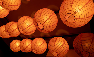 a round, bright orange lantern