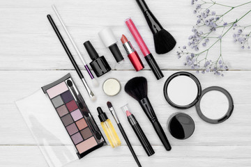 Various makeup cosmetics flat lay background.