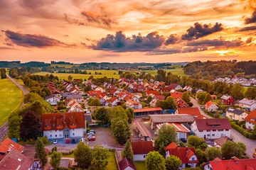 Amazing colorful sunset over the small village in Germany