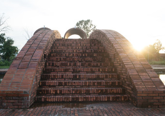 A bridge of bricks at sunset