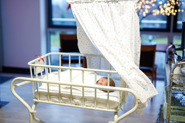 Obraz na płótnie Canvas Portrait of cute adorable newborn baby girl in birth hospital.