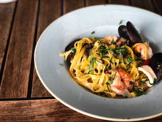 fresh italian pasta with seafood - spaghetti, tagliatelle and fresh fusilli 