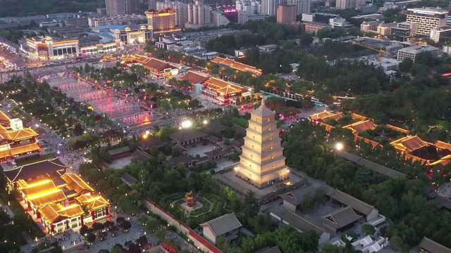 aerial video of giant wild goose pagoda and fountain square in nightfall,xian, China