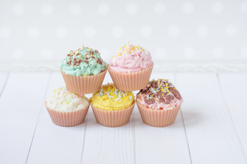 cute candles in the form of cakes pastel colors 