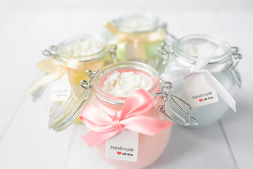 handmade candles in glass jars pastel colors