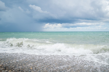 Wave on the beach, sea foam in the sea, storm sea