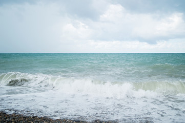 Fototapeta na wymiar Wave on the beach, sea foam in the sea, storm sea