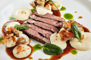 Restaurant Plate of Black Angus Beef Fillet with Warm Potatoes in Cheese Sauce and Mushroom Espuma