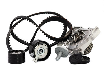 Kit of timing belt with rollers and pump on a white background