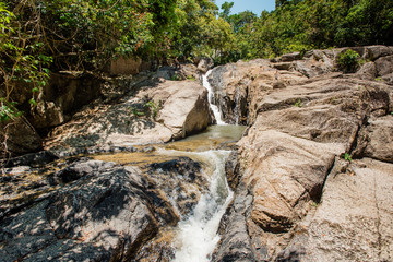 A small waterfall in the rainforest on the island of Phangan Thailand