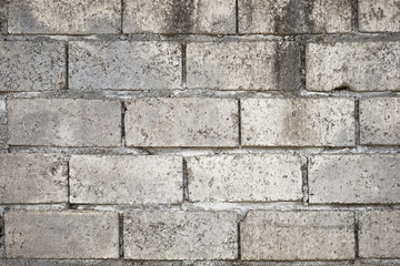 Abstract weathered textured grey brick wall background