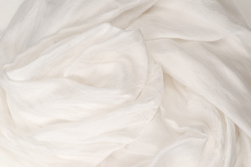 Fototapeta na wymiar Soft smooth white silk fabric background. Fabric texture.