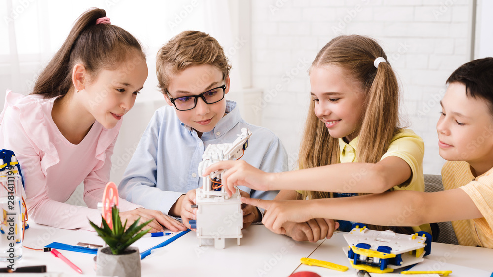 Poster Classmates creating modern robots at stem class