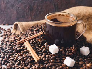 Turkish espresso coffee in a glass Cup on the table with coffee beans