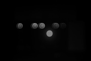 A black-white bokeh in dark night.