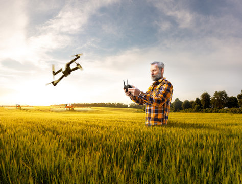 Beautiful senior farmer use new technology for agronomy